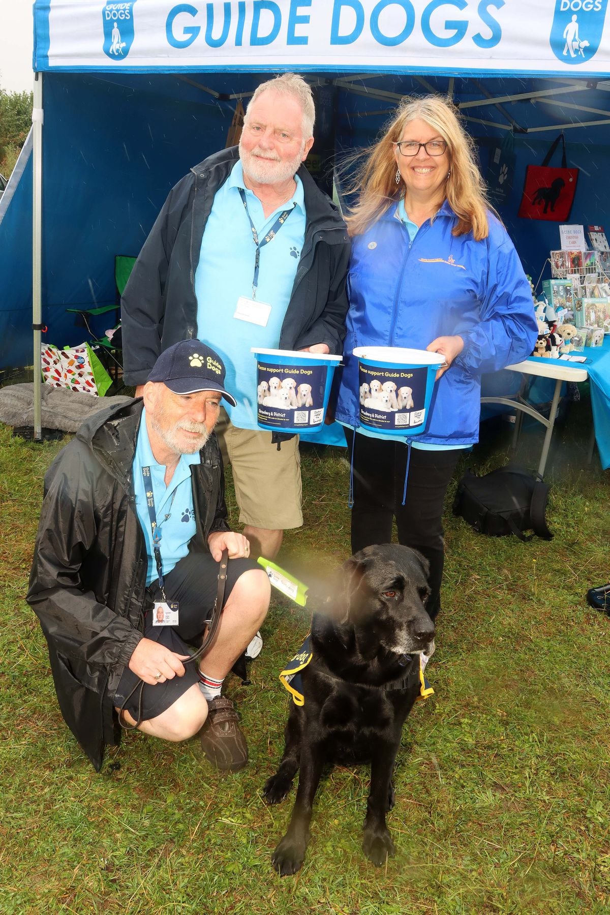 At the Guide Dogs For The Blind stall were, front, Darren Clutton  from Telford, with Quincey, and Rob Corfield and Dianne Beaumont from Shrewsbury