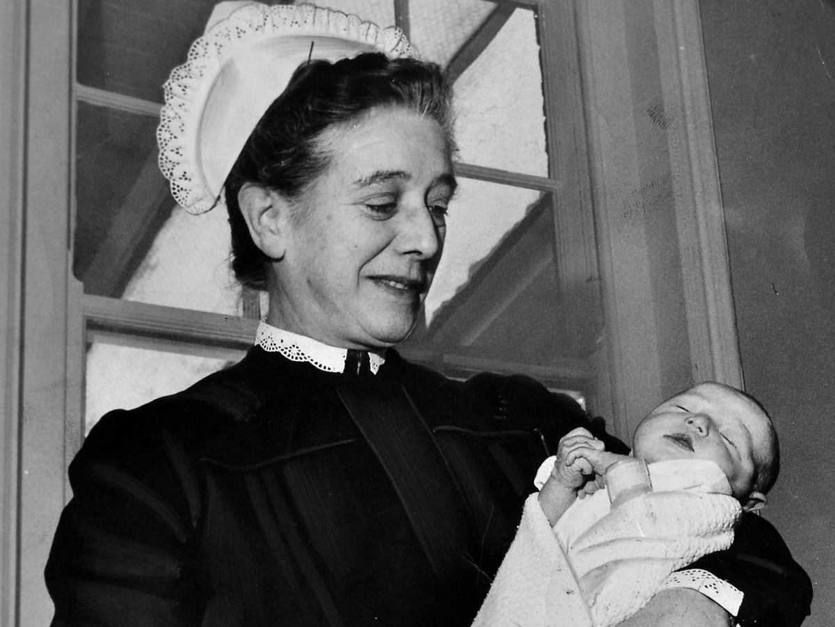 Matron Irene Braithwaite with a newborn baby in 1962.
