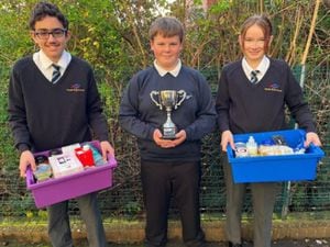 Meole Brace students Kiri Kyriakou, Cieron Ure and Charlie Smallman pictured with some of the donations and the Elaine Emberton Cup