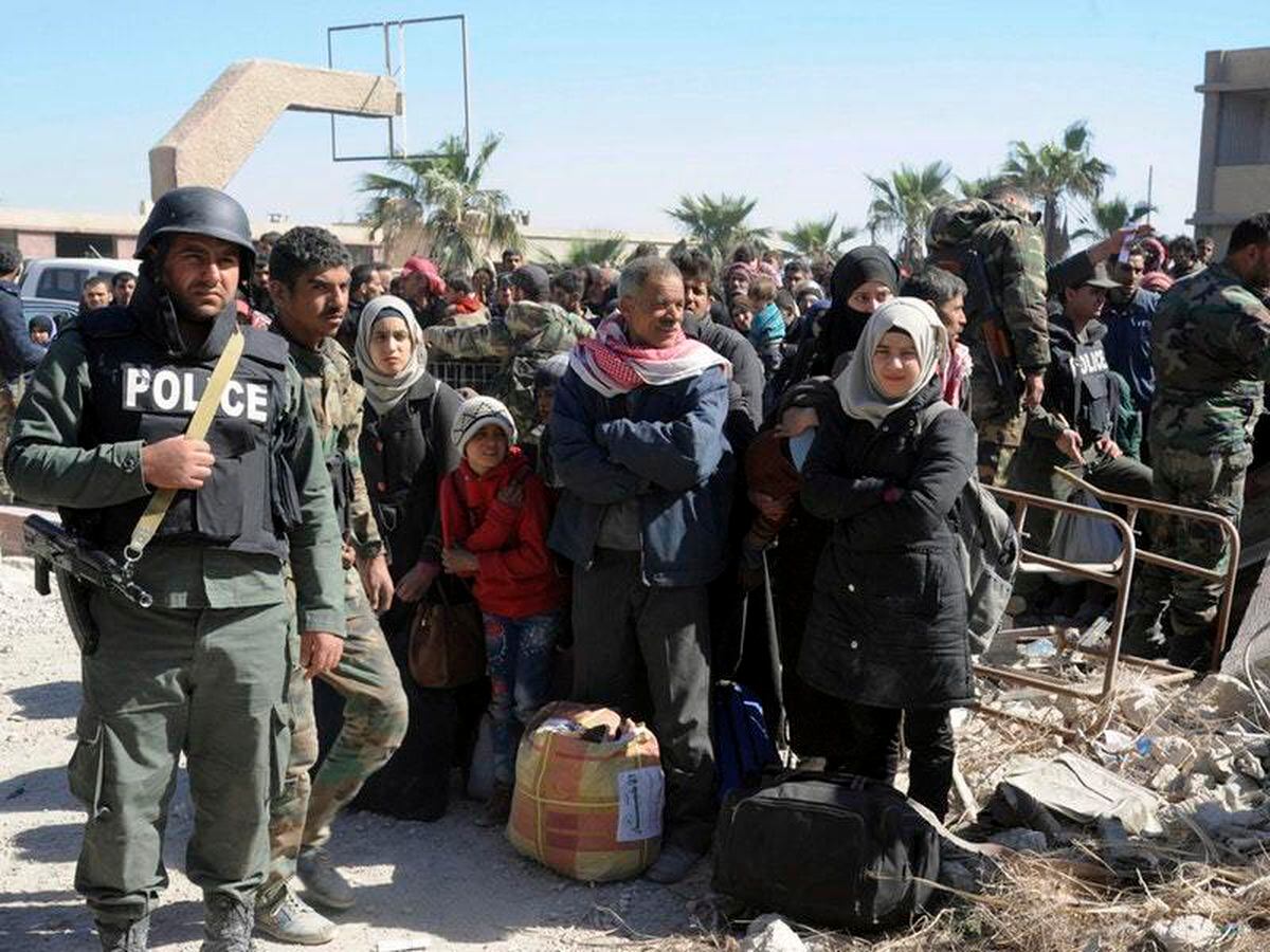 Civilians flee the fighting (Sana/AP)