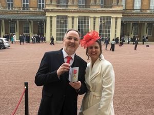 Arwyn Watkins and his wife Vicky outside Buckingham Palace