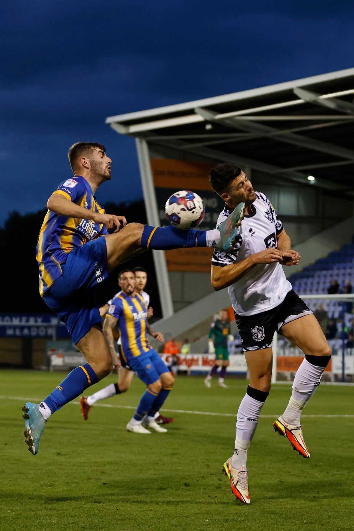 Tom Bloxham of Shrewsbury Town and Connor Hall of Port Vale (AMA)