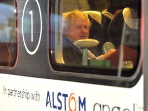Boris Johnson pictured passing through Wolverhampton on a train