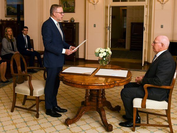 Anthony Albanese (left) is sworn in as Australia's Prime Minister by Australian Governor-General David Hurley