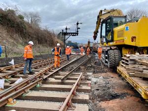 Rails being installed using a rail mounted crane