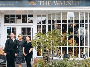 Karen Lee, centre, with staff outside The Walnut