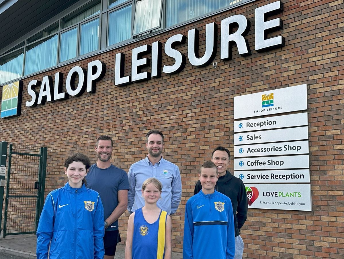 Salop Leisure’s marketing manager Ed Glover (centre back row) with coaches and young athletes from Shrewsbury Athletics Club.