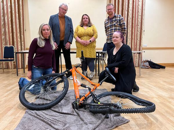With the mangled wreck of a bike after her son was hit by a car is Angela Warren (front right), mum and campaigner Katie Blant (front left), and (back from left) Councillor Chris Lemon, Shropshire Council's Ffion Horton and The Priory School's head of maths Jeremy Tudor