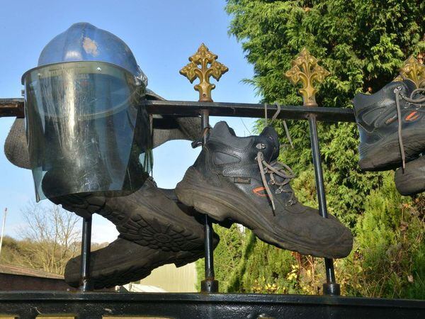 The boots and helmet hung on the Coalbrookdale Foundry gates in November 2017 
