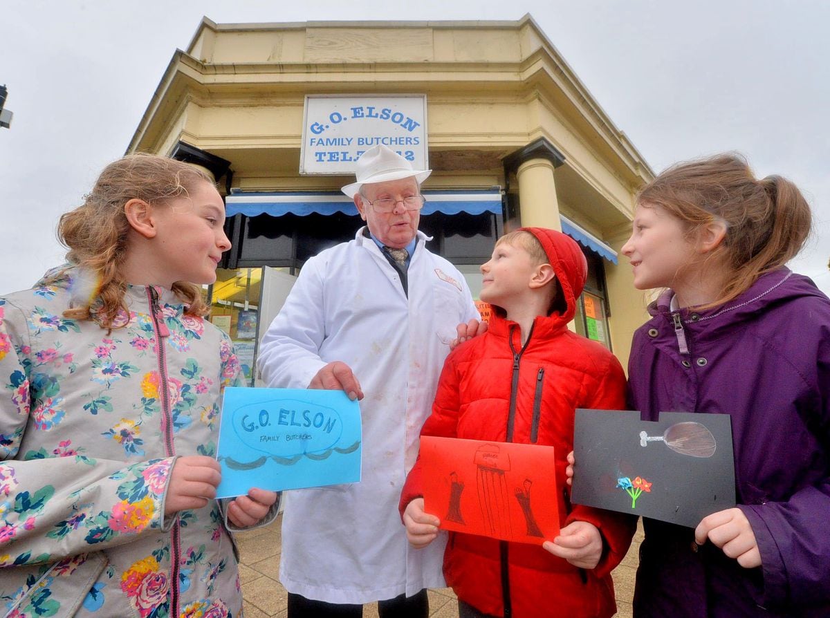 Butcher Granville Elson gets cards from Coleham Primary School pupils