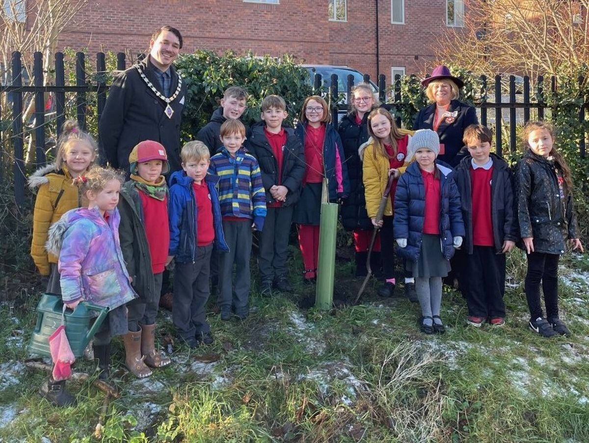 The tree planting at Our Lady and St Oswald's primary school