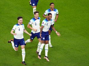 Marcus Rashford, second right, and England celebrate their first goal against Wales