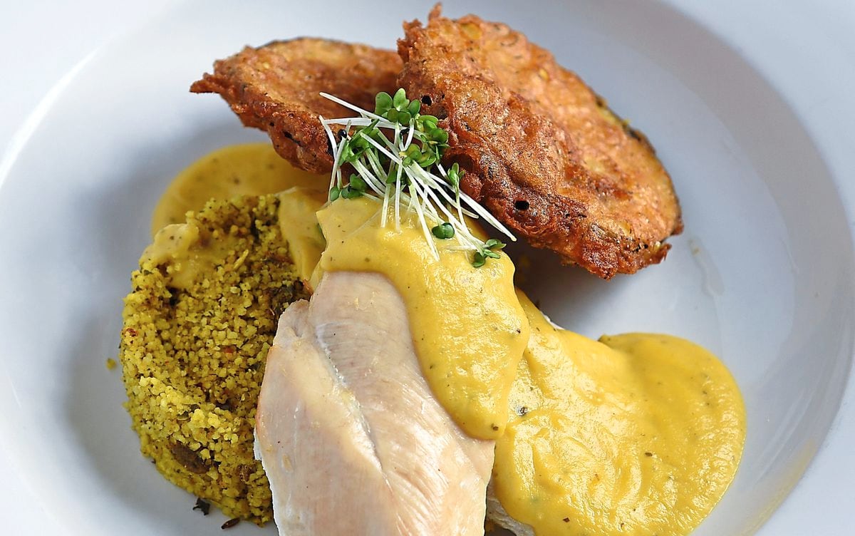 Oooh what a dish – breast of chicken, apricot and coriander sauce, spiced couscous, aubergine frittersPictures by Russell Davies