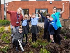 Children from Mereside Primary School pictured planting a time capsule at the Oxbow Manor Care UK Care Home in Shrewsbury. Picture by Shaun Fellows / Shine Pix Ltd