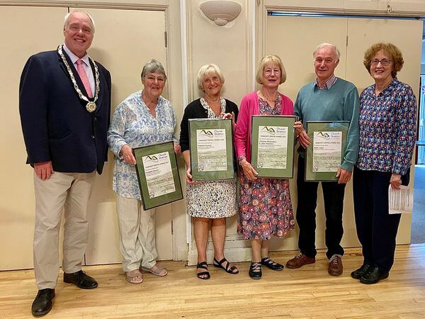 Town mayor Andy Munro, left, with award winners and deputy mayor Sheila Davies, master of ceremonies for the awards, is on the right. Pictures: Vicky Rich