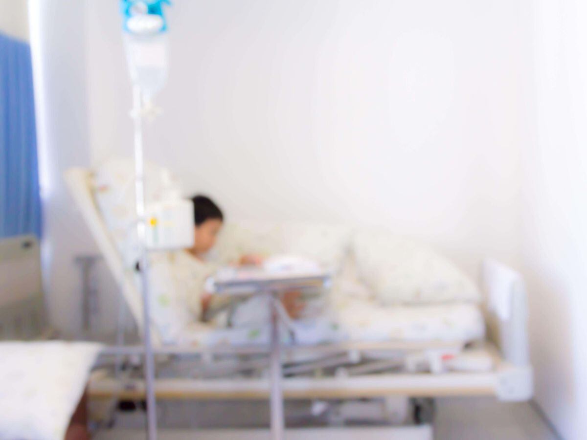 A blurred image of a child in hospital