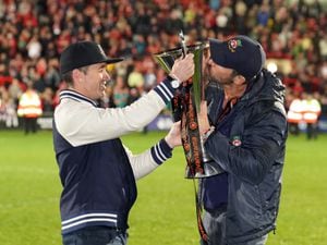 Wrexham co-owners Rob McElhenney and Ryan Reynolds with the National League title trophy 