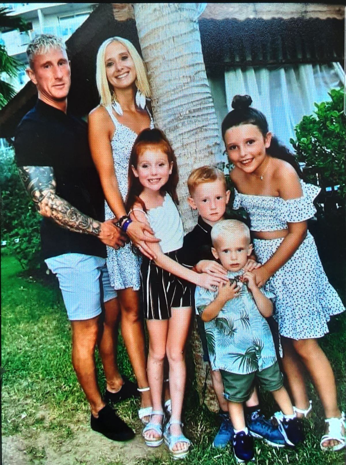 Shane Evans and his children and partner, Lisa