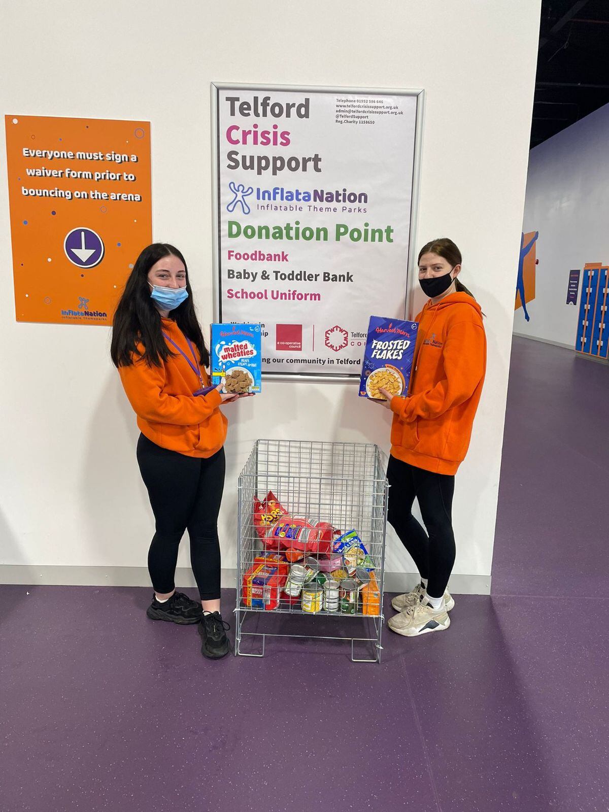 Tilly Dodd and Bethany Whittall from Inflata Nation Telford at the site's collection point for the Telford Crisis Centre 