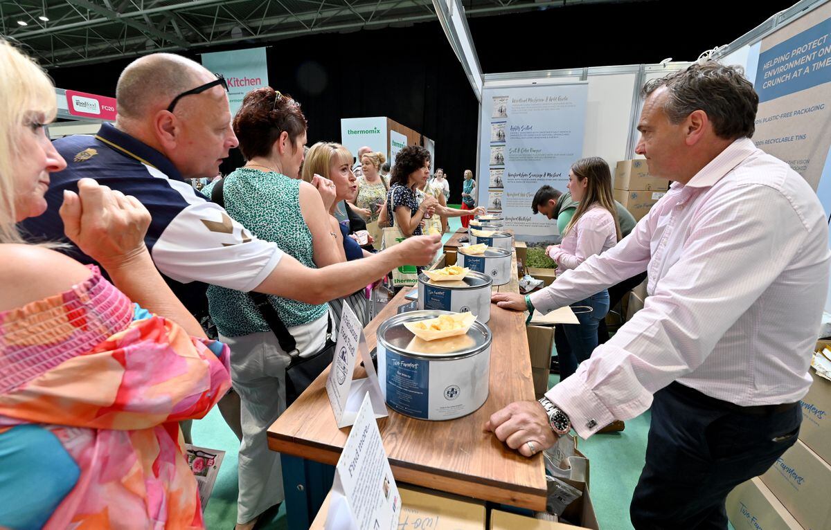 People sample the different flavours on offer by Two Farmers Crisps