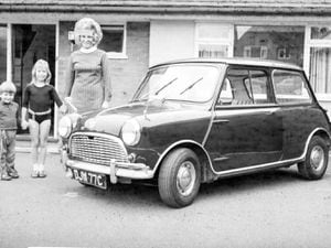 The "mystery" family photographed next to the Mini. Picture: Rupert Brun