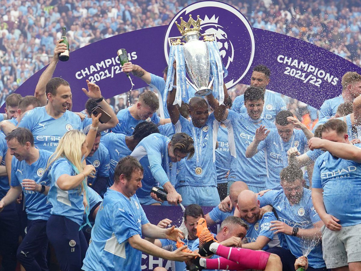 Manchester City's Fernandinho lifts the Premier League trophy following the the Premier League match at The Etihad Stadium, Manchester. Picture date: Sunday May 22, 2022. PA Photo. See PA story SOCCER Man City. Photo credit should read: Martin Rickett/PA Wire...RESTRICTIONS: EDITORIAL USE ONLY No use with unauthorised audio, video, data, fixture lists, club/league logos or "live" services. Online in-match use limited to 120 images, no video emulation. No use in betting, games or single club/league/player publications..