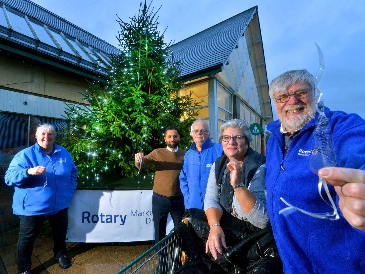 The Tree of Light in Market Drayton. From left: Janey Manton, store manager; Hamel Purohit; Alan Cartwright; Dianne Spellar (store community champion); Bill Manton