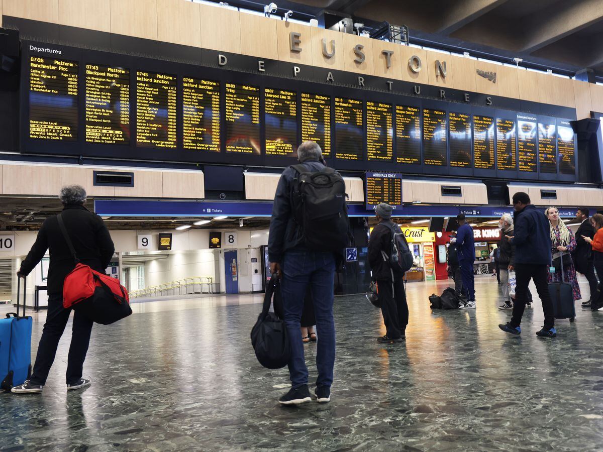 Passengers at Euston station in London,