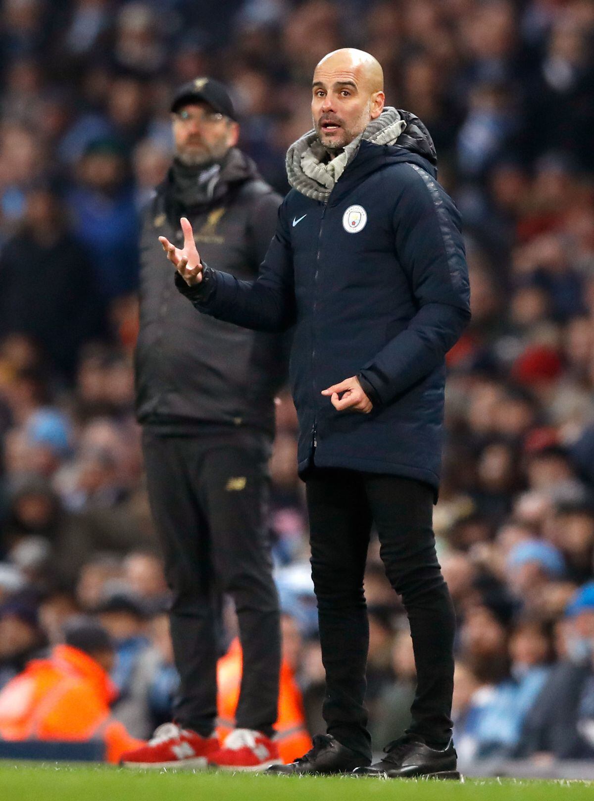 Manchester City manager Pep Guardiola (right) and Liverpool manager Jurgen Klopp during the Premier League match at the Etihad Stadium, Manchester. PRESS ASSOCIATION Photo. Picture date: Thursday January 3, 2019. See PA story SOCCER Man City. Photo credit should read: Martin Rickett/PA Wire. RESTRICTIONS: EDITORIAL USE ONLY No use with unauthorised audio, video, data, fixture lists, club/league logos or "live" services. Online in-match use limited to 120 images, no video emulation. No use in betting, games or single club/league/player publications..