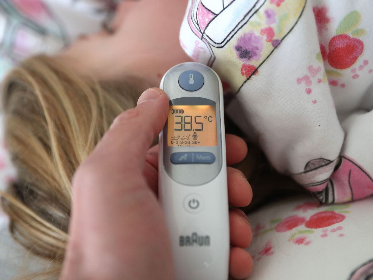 Thermometer being used on child