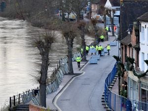Flood barriers are installed on the Wharfage in Ironbridge