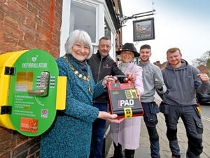A new defibrillator has been installed on the wall of the Pheasant Inn in Newport. Pictured from left are Mayor Lyn Fowler, landlord David Trigg, Sally Angell-James, and Jamie Frost and Tom Halfpenny from JDF Electrical Services