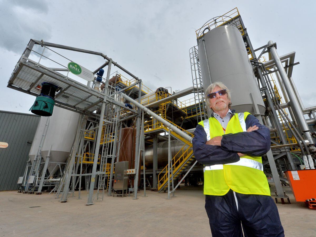 Elwyn Griffiths pictured with some of the new machinery that burns off farm manure to create green energy