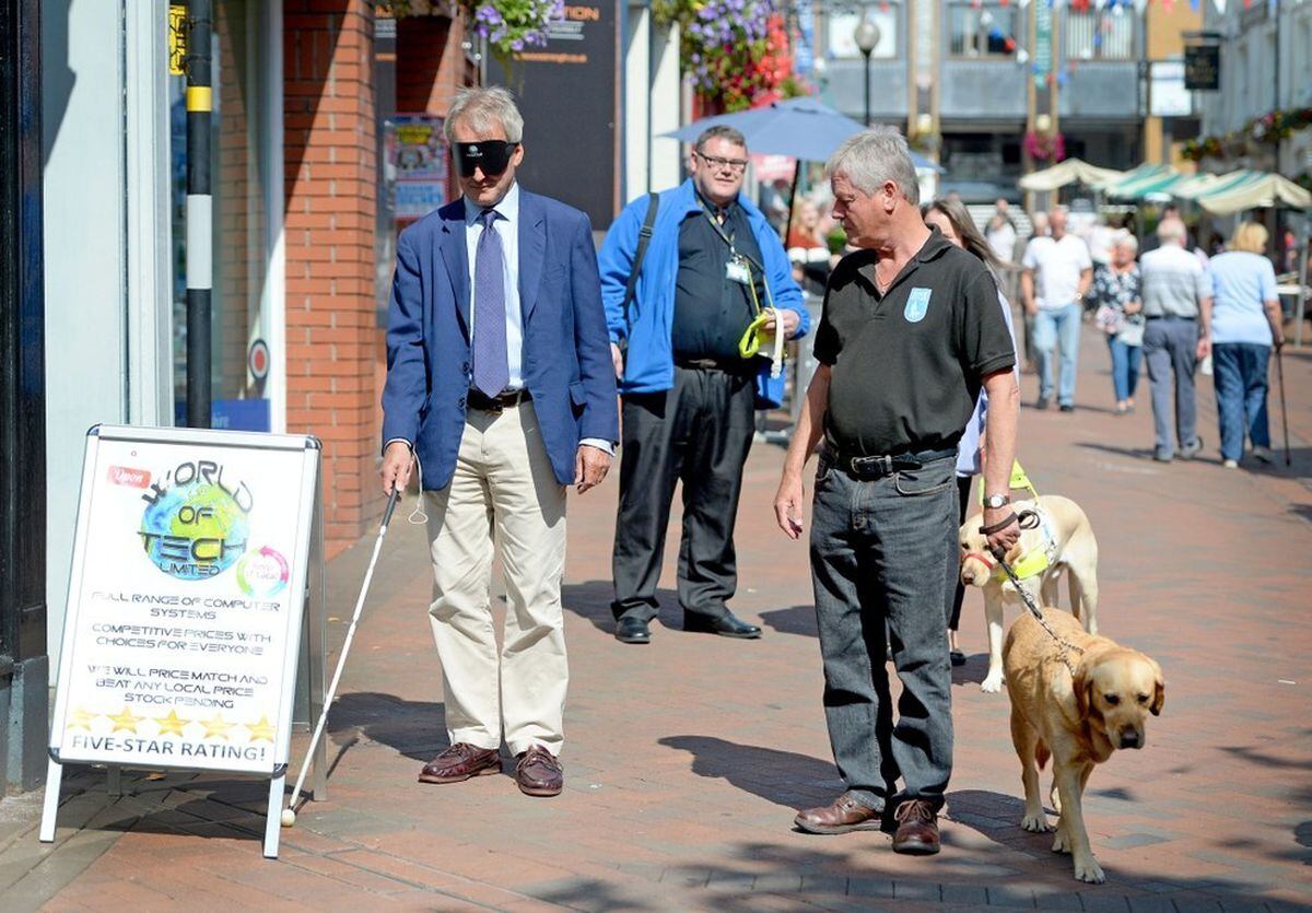 Owen Paterson walks blindfolded through Oswestry