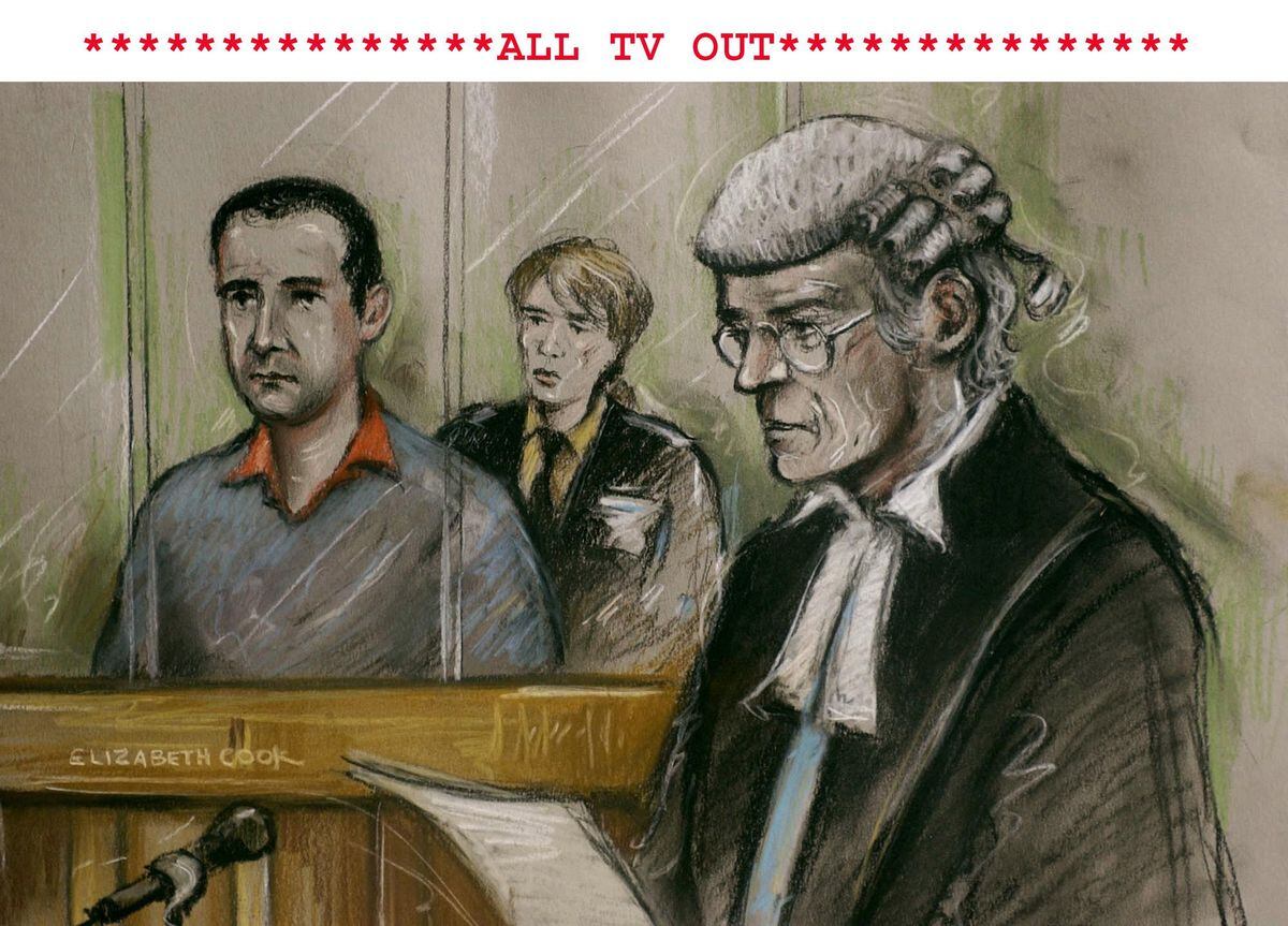 Artist's impression of Robert Hendy-Freegard, standing in the dock at Blackfriars Crown Court, in central London, facing questions from prosecuting QC Godfrey Carey, at the start of his trial in January 2004