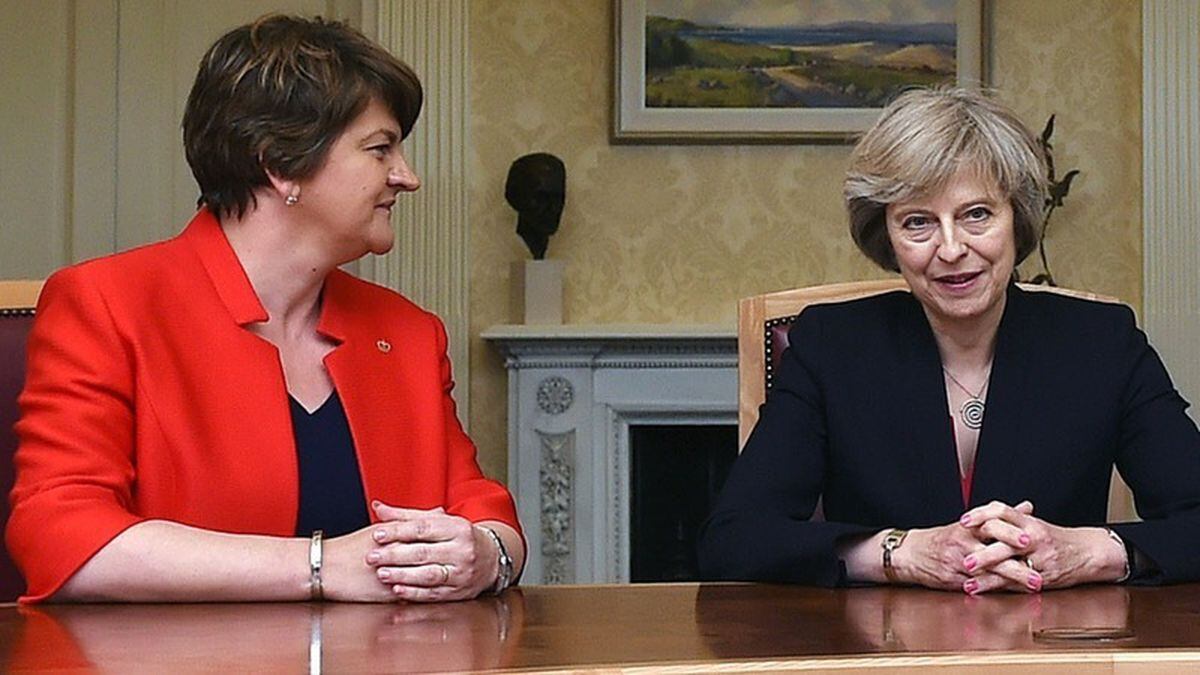 Theresa May and Arlene Foster are holding discussions as they look to strike a deal to prop up a minority Conservative government (Charles McQuillan/PA)
