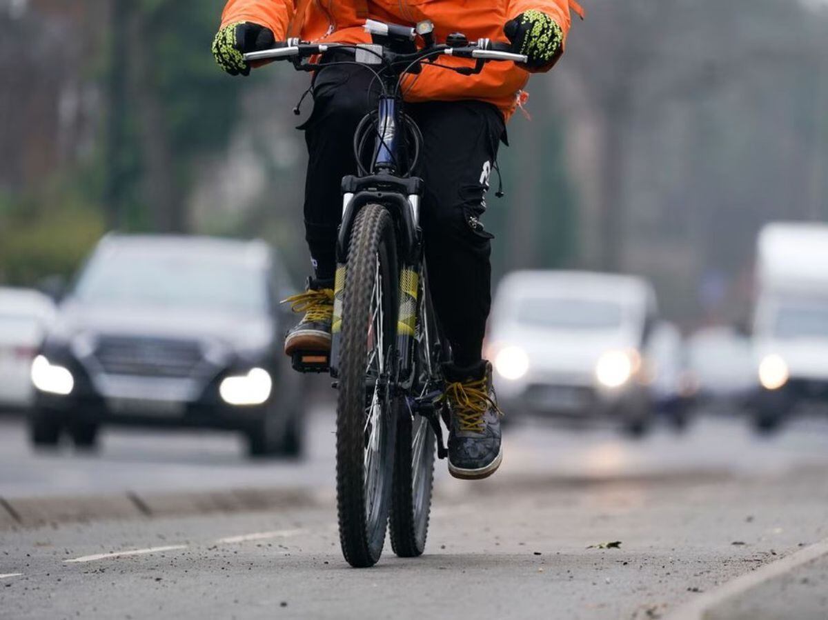 A women rides a bike in a cycle lane