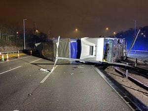 The lorry overturned following a crash with a car at Junction 10. Photo: Highways England