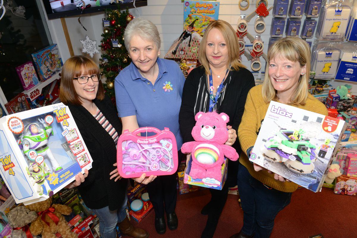 Sue Last, second from right, collecting toys on behalf of Telford Young Carers from one of our previous toy appeals