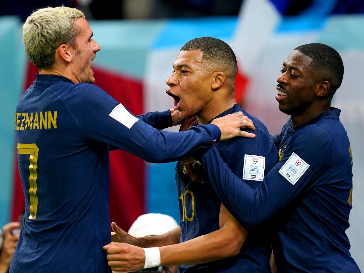 France’s Kylian Mbappe, centre, celebrates his goal against Australia with Antoine Griezmann, left, and Ousmane Dembele
