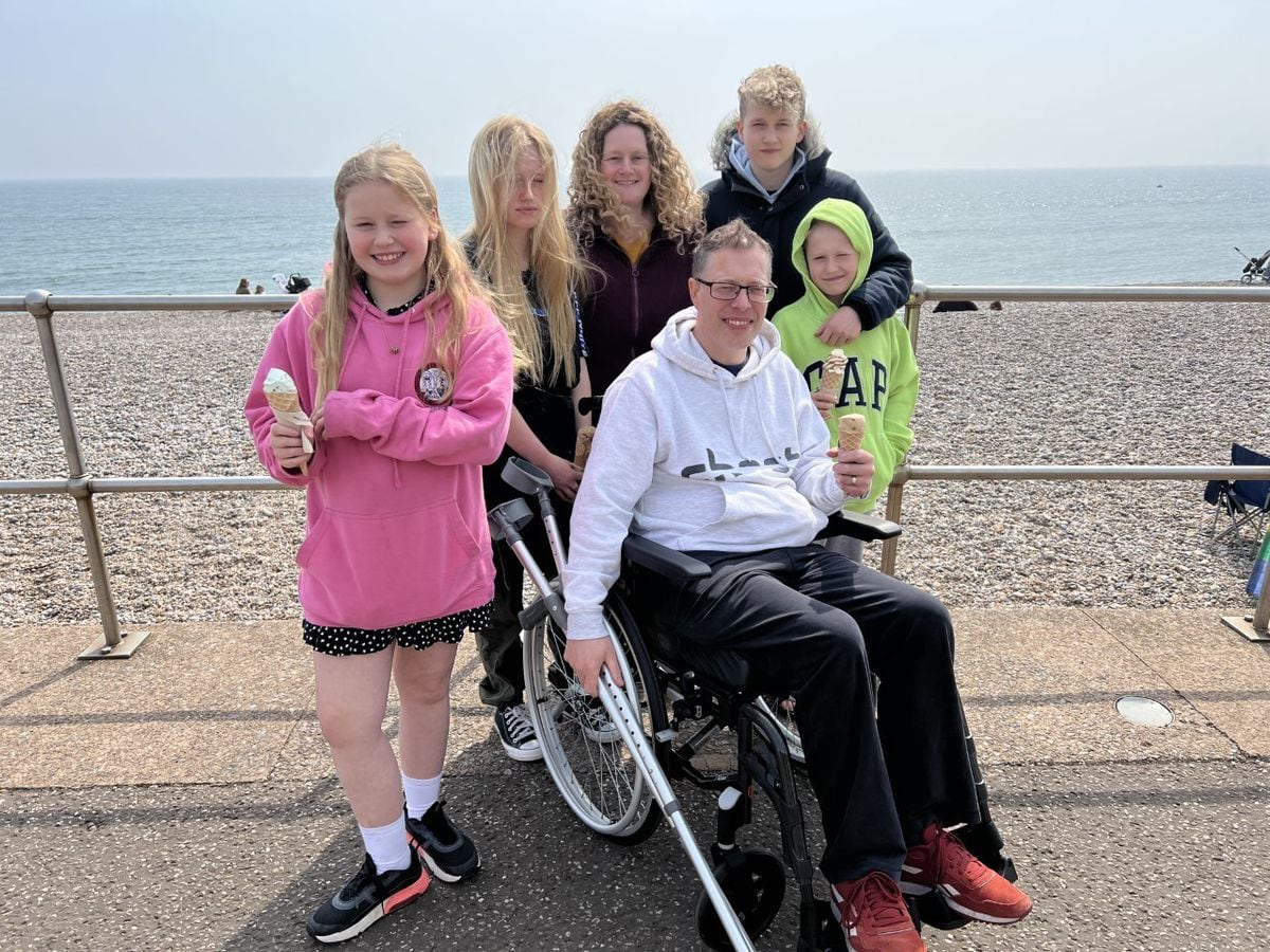 James in his wheelchair with wife Alex and children, Daisy (11), Holly (15), Paul (13), Thomas (10)