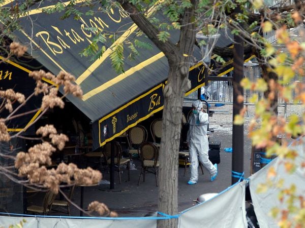 An investigator works outside the Bataclan concert hall