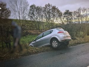 A car crashed into a ditch on Clun Road, Craven Arms 