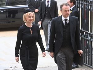 Prime Minister Liz Truss and husband Hugh O'Leary arrive for the Queen's state funeral. Photo: Geoff Pugh/Daily Telegraph/PA Wire.