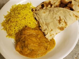 Coconut chilli chicken with roti and lemon rice