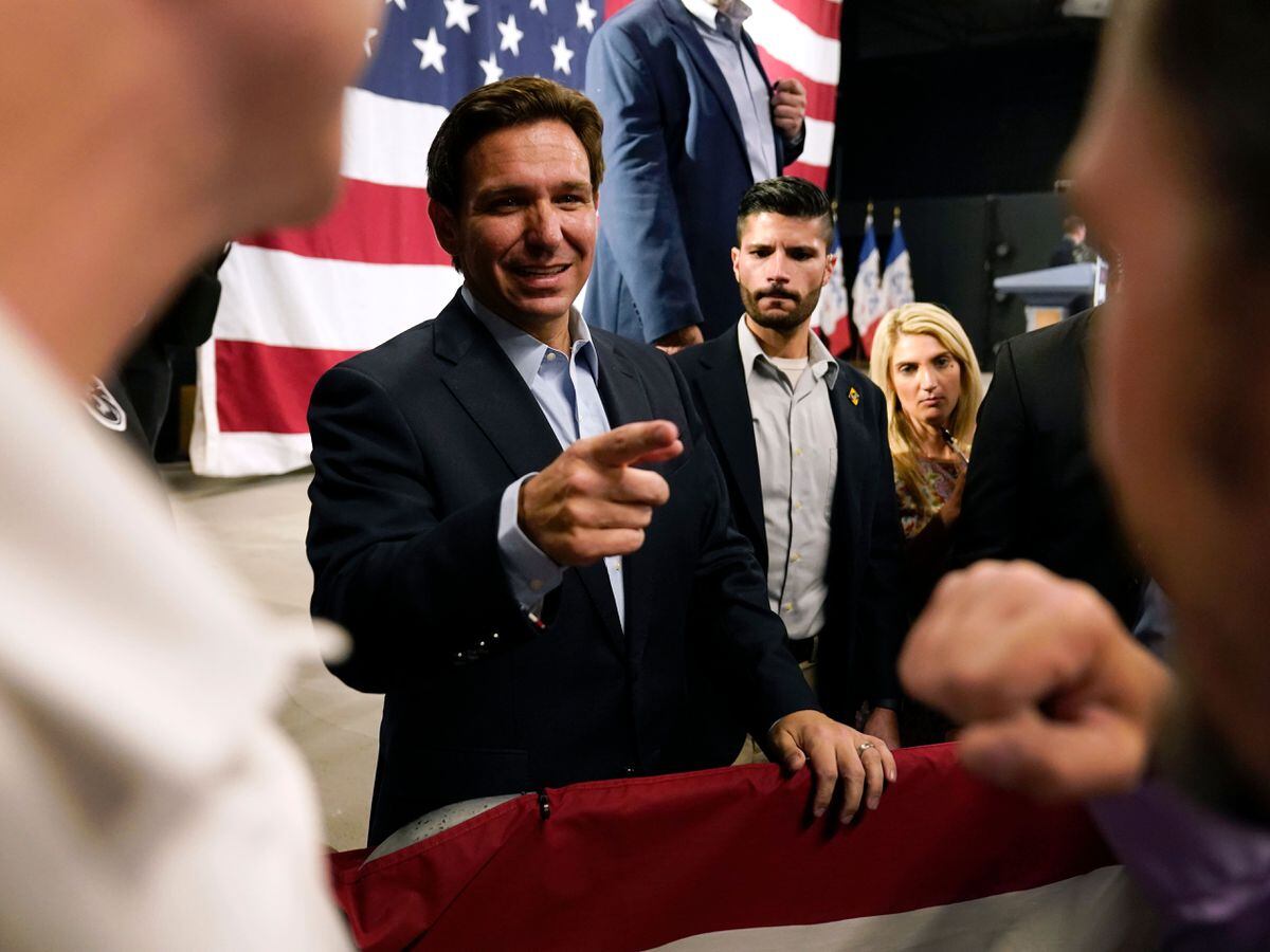 Republican presidential candidate Florida Gov. Ron DeSantis greets audience members during a campaign event, Tuesday, May 30, 2023, in Clive, Iowa