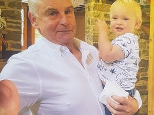 Kevin Magill pictured with one of his grandchildren, Charlie