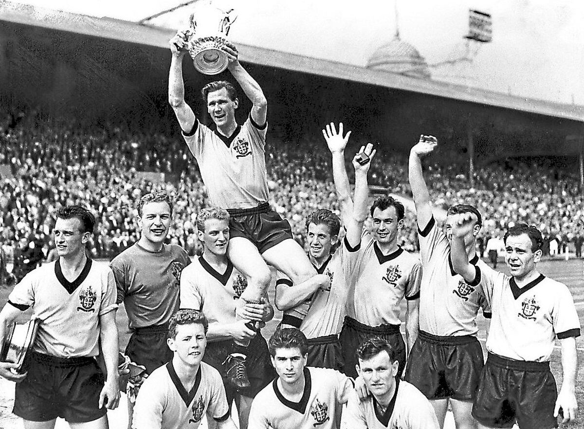 Wolves captain Bill Slater holds the FA Cup aloft in 1960
