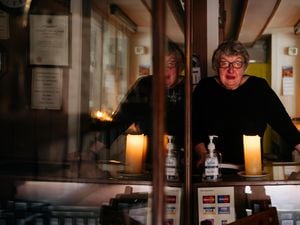 June Williams, of RJ Christian Jewellers, who are without power and working by candlelight