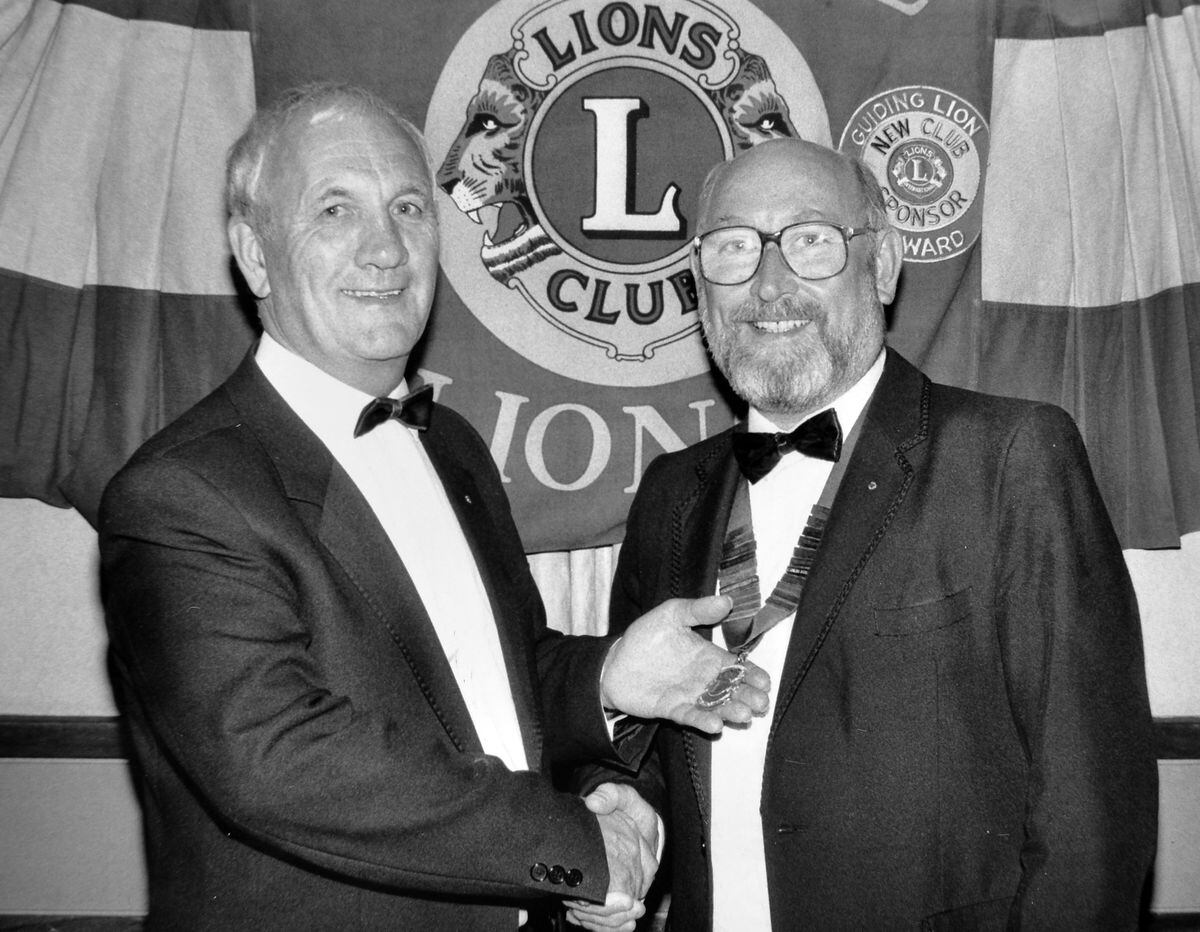 Ken, right, becomes president of Telford Lions Club at the club's annual installation dinner at the Charlton Arms Hotel, Wellington, in 1991. He is receiving the chain of office from the retiring president, Bryan Heaven.